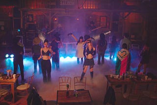 Four people in a relationship with each other spend a night dancing at a cowboy themed bar.