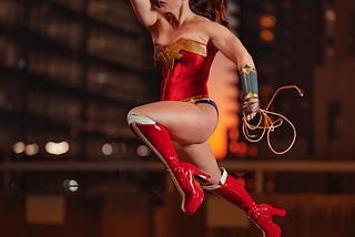 This is a photo of Wonder-woman showing off her superpowers while running in mid air.