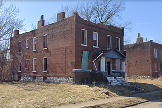 St. Louis Ave. multifamily home. Currently inhabited and needing major rehab.