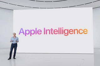 IMAGE: Apple’s VP of Software Engineering, Craig Federighi, in front of a screen that reads Apple Intelligence