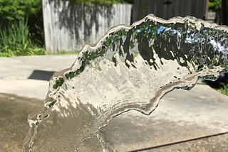the image shows water coming out of a hose. It’s pretty