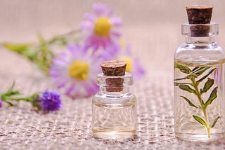 essential oils and violet flowers