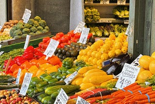 A market stall with various types of vegetables