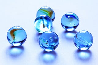 Six blue marbles