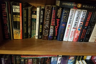 a bookshelf full of Stephen King books