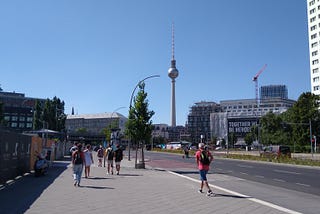 A snapshot of the road leading to Alexanderplatz (Berlin) with the famous TV Tower standing tall in the background.