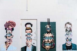 The graffiti with 4 people portrayed as the russian dolls.