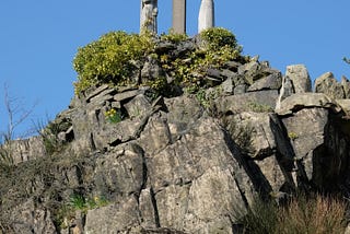 Statue showing the crucified Jesus flanked by Mary and St John