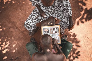 Men playing ludo. Photo by Tope A. Asokere from Pexels