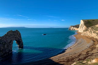 View of Durdle Door, a natural limestone arch on the Jurassic Coast near Lulworth in Dorset, England.