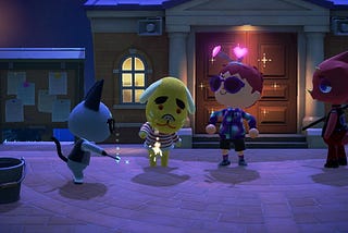 Raymond the cat and Benjamin the dog hold lit sparklers with Marek watching while looking proud in a night time scene.