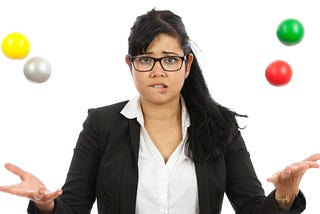 Woman juggling too many balls at once