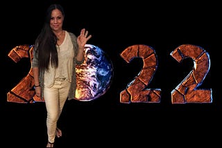 An image of stone-like 2022 with the Earth in place of the zero and the author photoshopped herself in the image, waving to the readers.