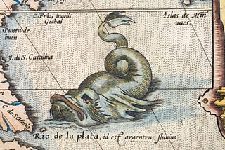 A sea monster on the edge of an old map.