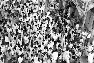 Kaushal Ji stands ( with his hands stretched out) along with Atal Ji on the jeep.