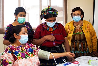 A group of comadronas in Quetzaltenango participate in a training on how to use equipment provided by the project to help them care for pregnant women in their community.