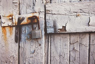 Abandoned and locked wooden door