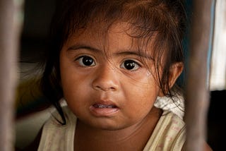 Photo of little girl looking scared.