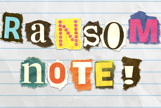 Torn paper letters on lined paper spelling out “ransom note!”