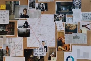 a conspiracy theorist’s “evidence board” replete with red string connecting all of the various photographs, news clippings, and notes to one another
