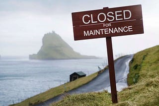 Close for Maintenance sign in front of an outdoor path in a Faroe Island.