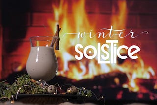 virtual fireplace with eggnog and winter decor in forground