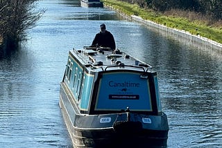 Author at the helm of the rental canal boat.