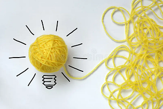 Thread of a yarn making a light bulb.