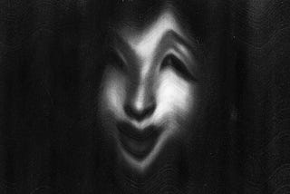 Distorted, black and white image of a woman smiling