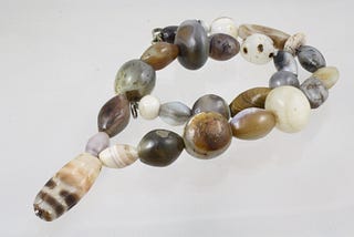 Necklace made of agate beads, including a Tibetan dZi bead