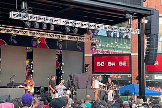 The band Grayscale performing on stage at Ballpark Village in St. Louis.