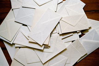 Dozens of blank envelopes scattered on the floor