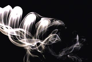 White smoke on black background