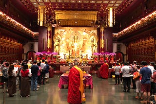 Photo by Author — worshipping at the Buddha Tooth Relic Temple & Museum (新加坡佛牙寺龙华院), Singapore