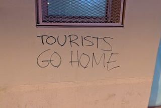 “Tourists go home” graffiti in Gràcia, Barcelona.