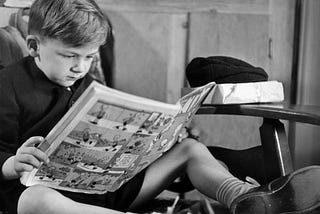 This is a boy reading a comic book Getty images/Hutton Archive