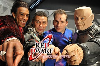 The main cast of Red Dwarf: Cat, Lister, Rimmer and Kryton