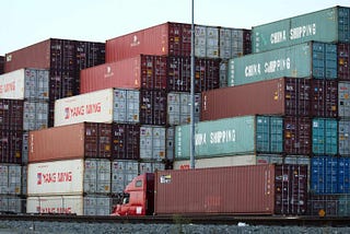 Dozens of shipping containers. The rise of globalization.