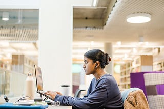 A student is working in the Laidlaw library.