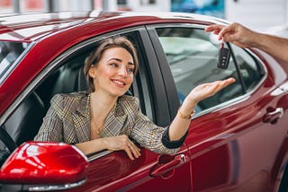 A female got a new vehicle key by applying Low Interest Car Loans in Canada