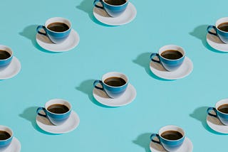 Image of many identical coffee cups.