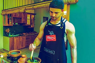 A Male Cooking at Ella Cooking Class