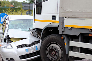 WHAT SHOULD I DO IF A COMPANY TRUCK DRIVER HIT MY CAR?