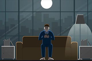 A man looks at his phone late at night.