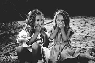 Two little girls laughing