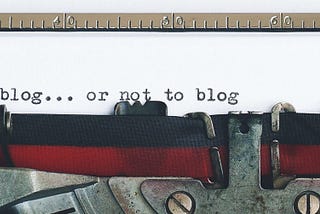 antique typewriter with the text “to blog…or not to blog”