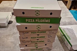 stack of pizza boxes