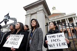 International students protest xenophobic policy on a college campus.
