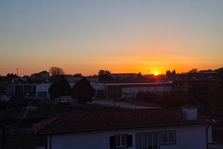 A village in the dark at sunset.