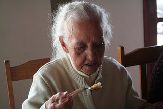 An elderly woman eating. A quiet reminder of how ordinary meals can carry hidden risks.